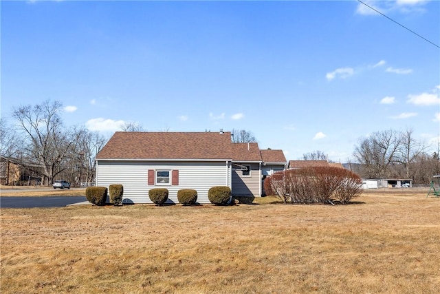 view of home's exterior with a yard