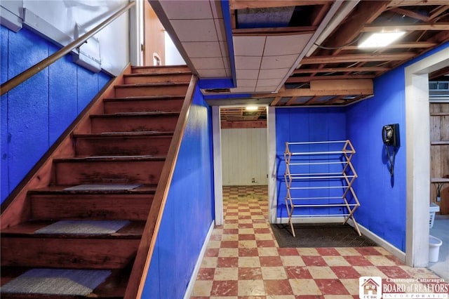 staircase with tile patterned floors