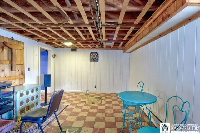 finished basement with tile patterned floors