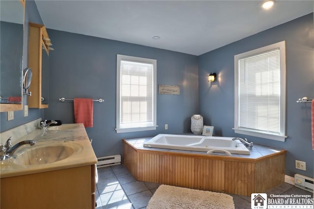 full bathroom featuring tile patterned floors, baseboard heating, a bath, and a sink