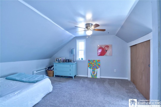 carpeted bedroom featuring a ceiling fan and vaulted ceiling