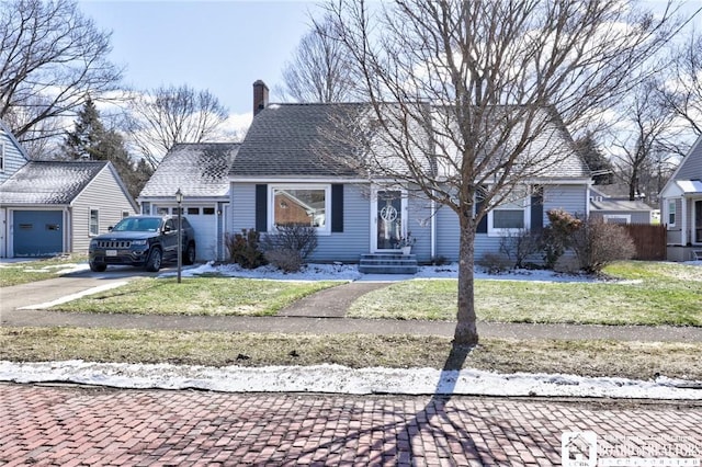 view of front of property with an attached garage, a chimney, driveway, and a shingled roof