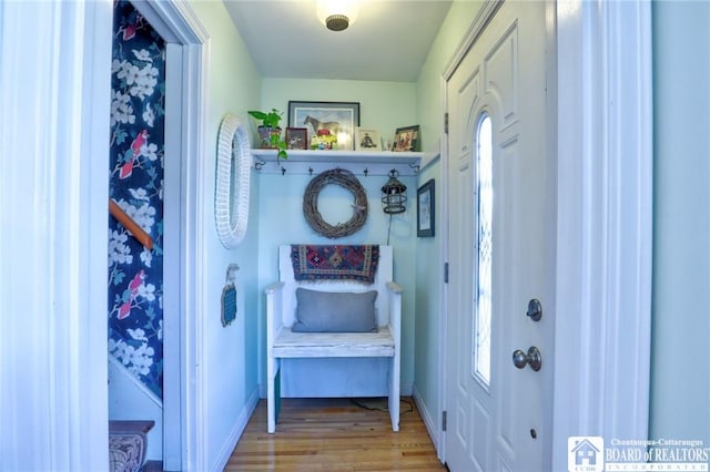 mudroom featuring baseboards and wood finished floors