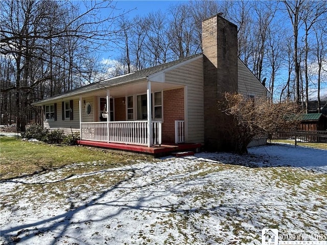 view of front of house with a porch and a chimney