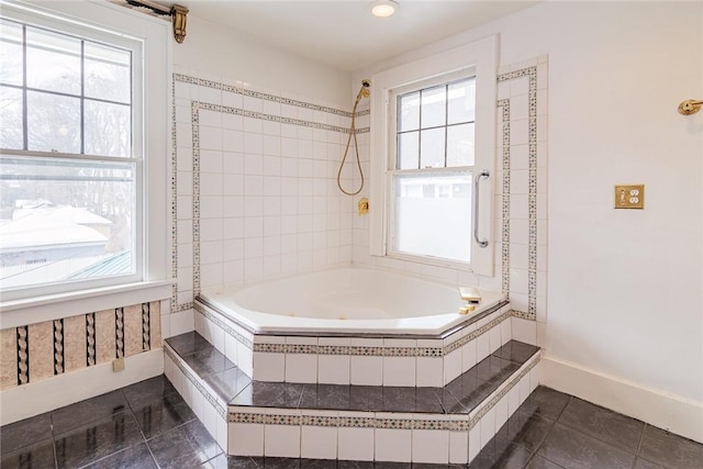 full bathroom featuring baseboards, plenty of natural light, shower / washtub combination, and tile patterned flooring