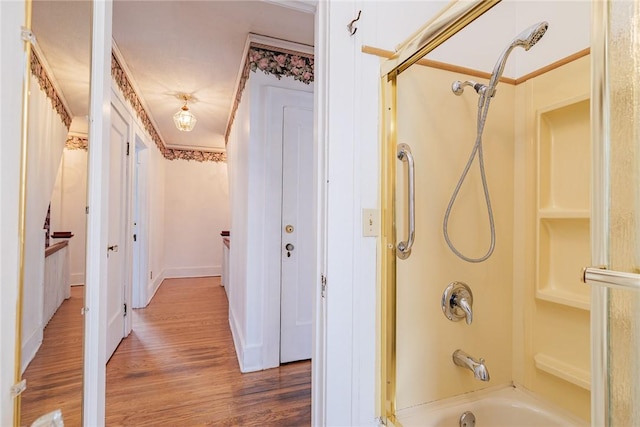 full bathroom featuring shower / washtub combination and wood finished floors