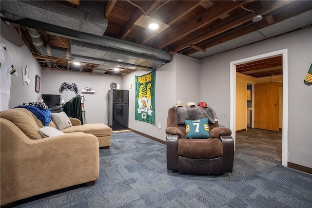 carpeted living area with baseboards