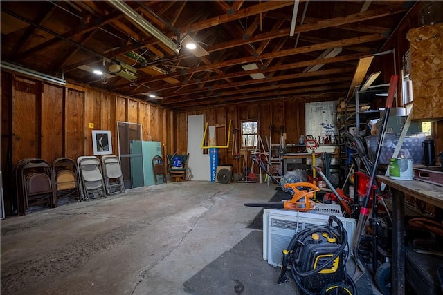 garage featuring a workshop area and a garage door opener