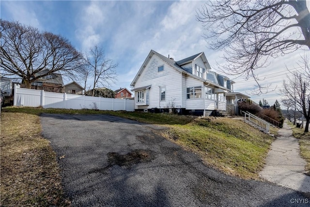 view of side of property with fence