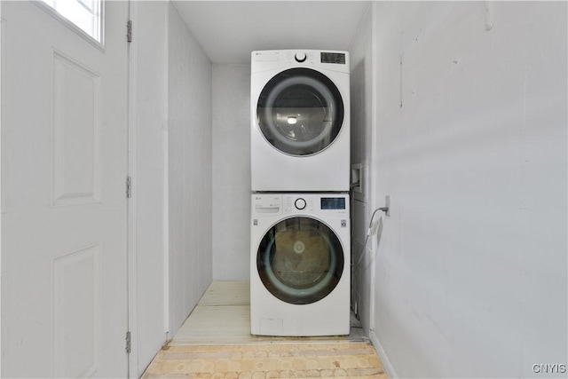 laundry room with laundry area and stacked washer and dryer