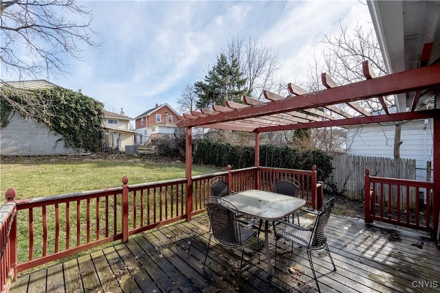 deck with outdoor dining space, a lawn, a pergola, and a fenced backyard