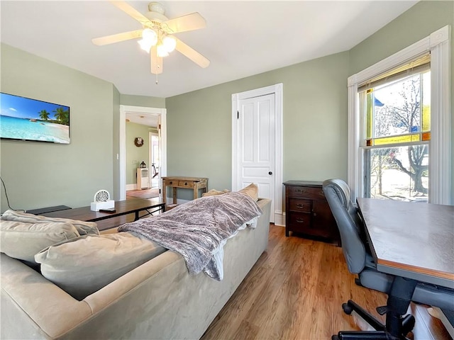 bedroom featuring a ceiling fan and wood finished floors