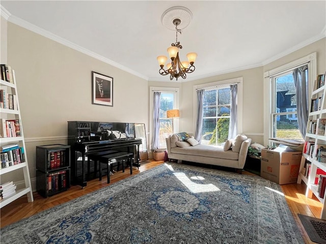 sitting room featuring a chandelier, wood finished floors, and crown molding