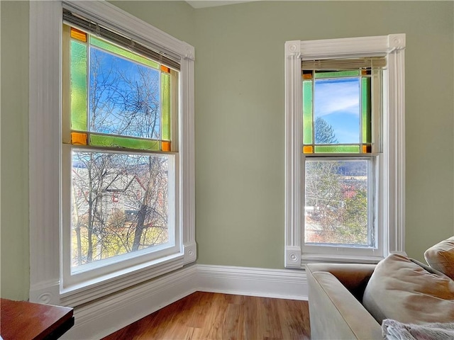 room details with baseboards and wood finished floors