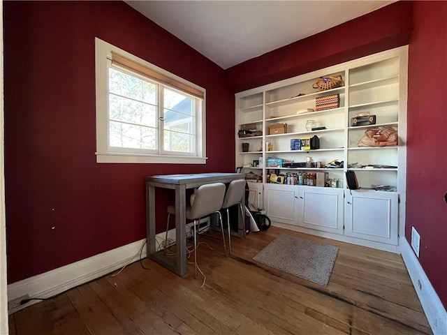 office with visible vents, baseboards, and hardwood / wood-style floors