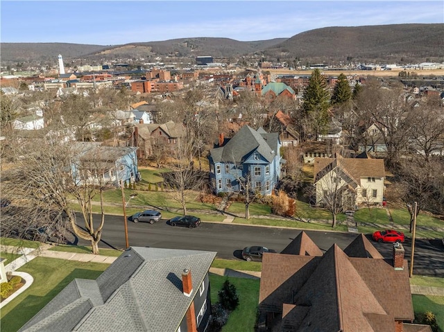 birds eye view of property featuring a mountain view