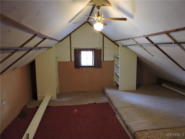 additional living space with light colored carpet, baseboard heating, and vaulted ceiling