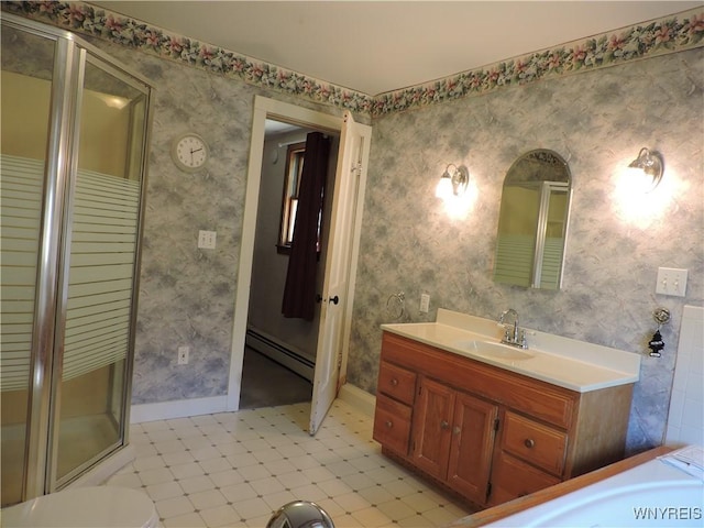 full bath featuring a baseboard heating unit, vanity, a shower stall, and wallpapered walls