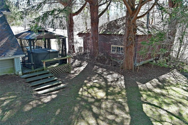 view of yard with a gazebo and a hot tub