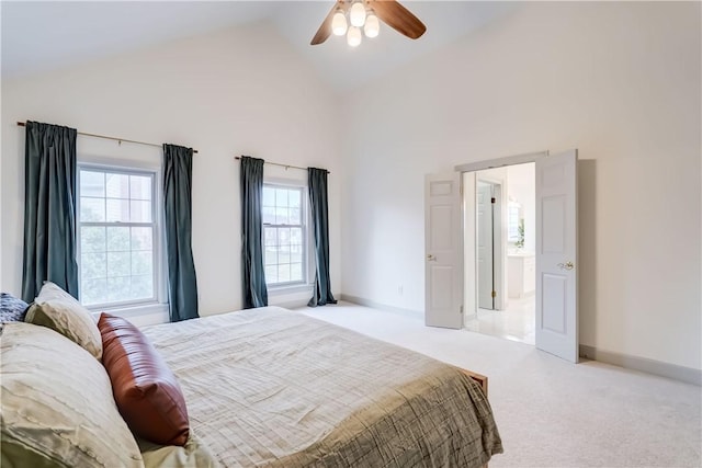 bedroom featuring ceiling fan, carpet flooring, baseboards, and high vaulted ceiling