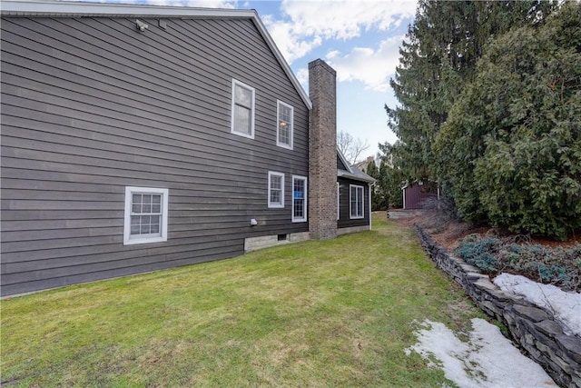 view of property exterior featuring a lawn and a chimney