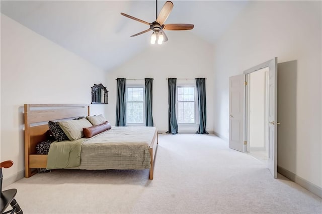 carpeted bedroom with baseboards, high vaulted ceiling, and ceiling fan