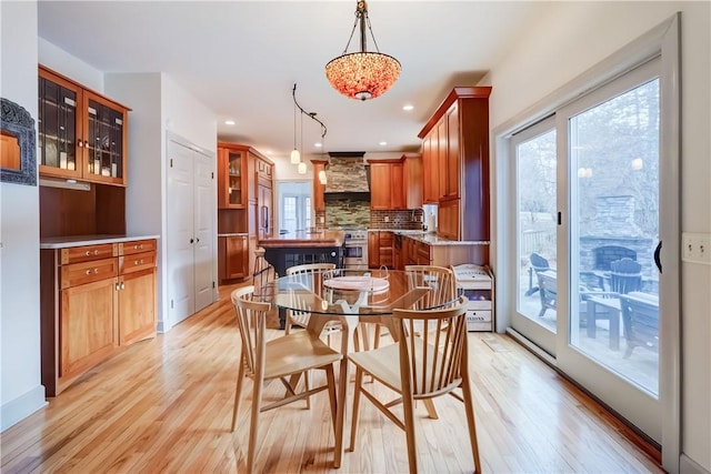 dining space featuring recessed lighting and light wood-style floors