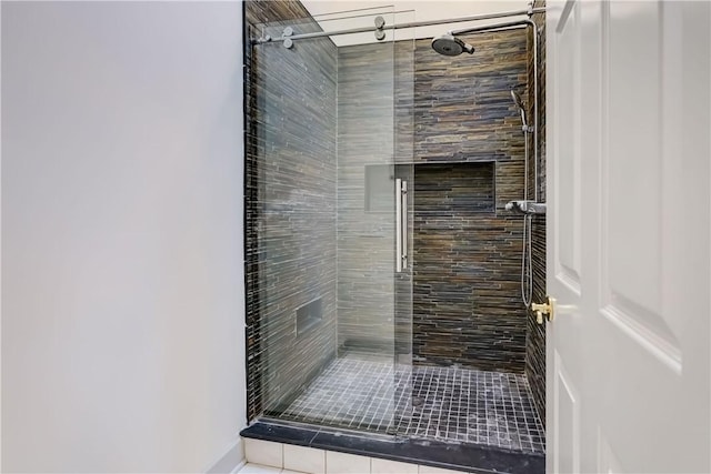 full bath with a shower stall