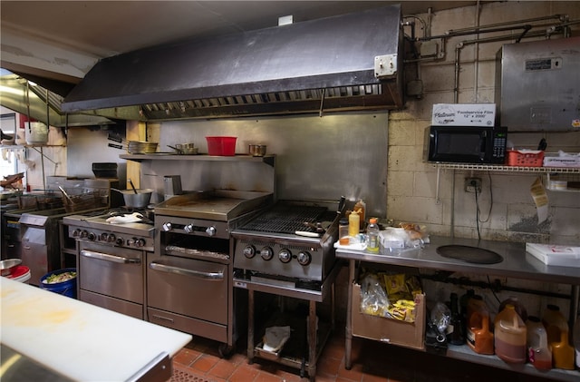 kitchen with black microwave and premium range hood