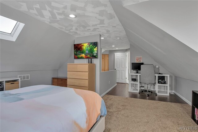 bedroom with visible vents, baseboards, recessed lighting, vaulted ceiling with skylight, and wood finished floors