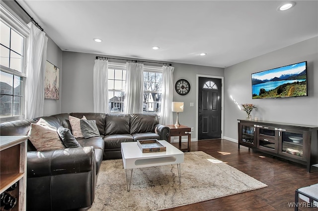 living room featuring recessed lighting, baseboards, and dark wood-style flooring