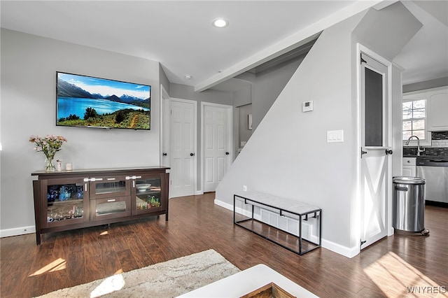 living room featuring recessed lighting, baseboards, and wood finished floors