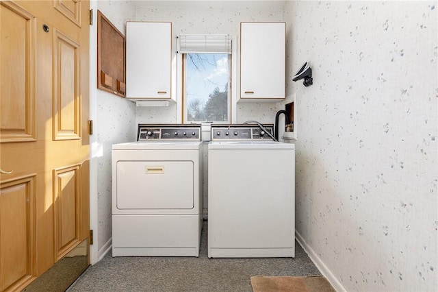 washroom with washer and dryer, cabinet space, baseboards, and wallpapered walls