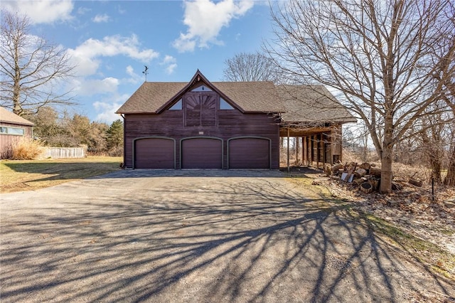 garage featuring driveway