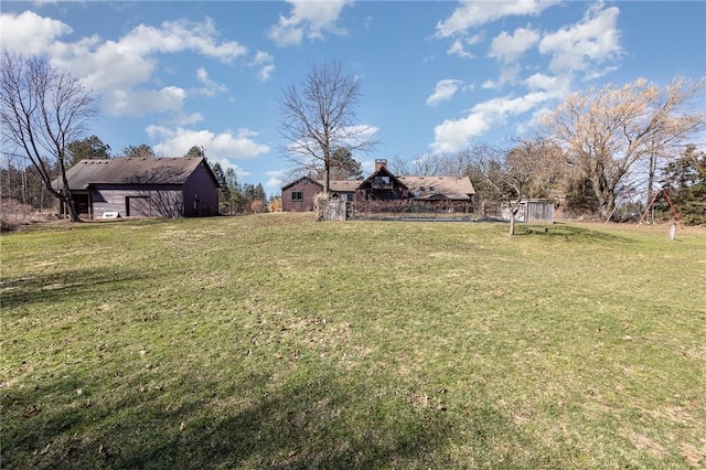 view of yard featuring an outbuilding and a barn