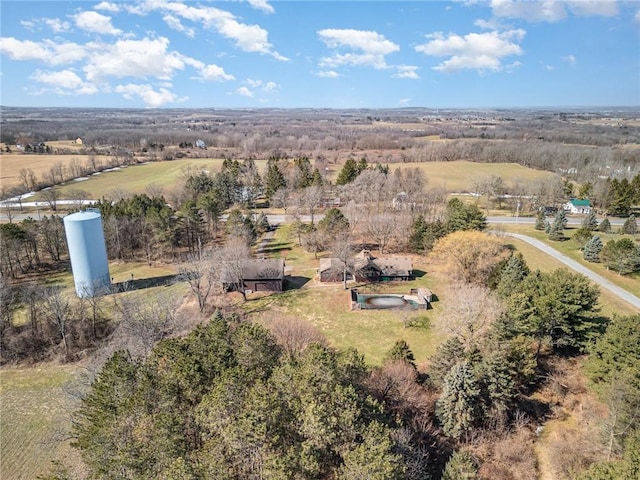 birds eye view of property with a rural view