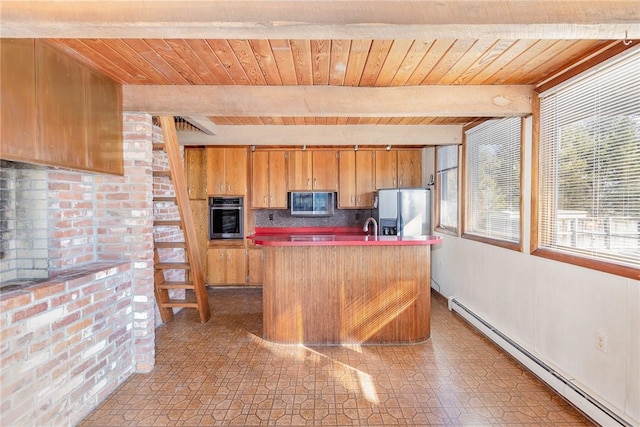 kitchen with beamed ceiling, a center island with sink, stainless steel appliances, wooden ceiling, and baseboard heating