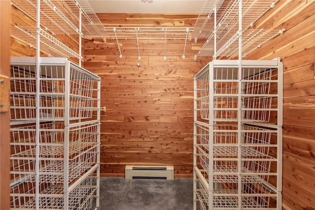 spacious closet with a baseboard radiator