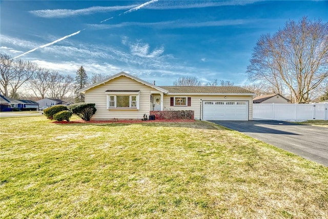 ranch-style house featuring aphalt driveway, an attached garage, a front yard, and fence