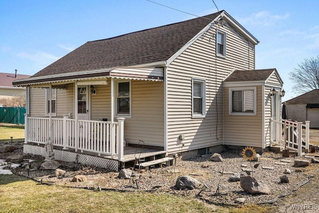 exterior space with a shingled roof