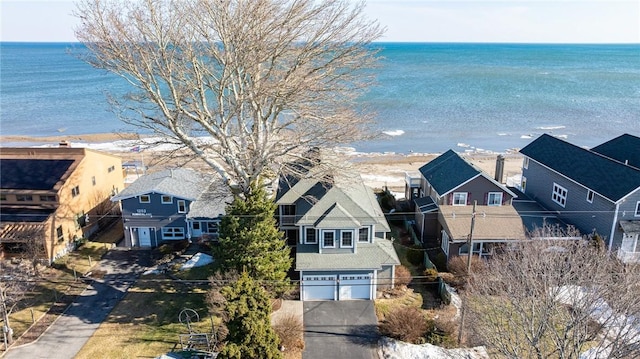 bird's eye view with a residential view and a water view