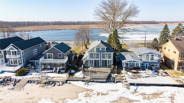 birds eye view of property featuring a water view and a residential view