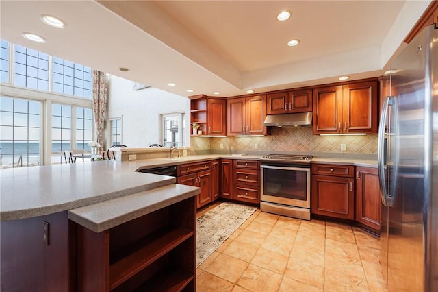 kitchen with under cabinet range hood, decorative backsplash, appliances with stainless steel finishes, a peninsula, and open shelves