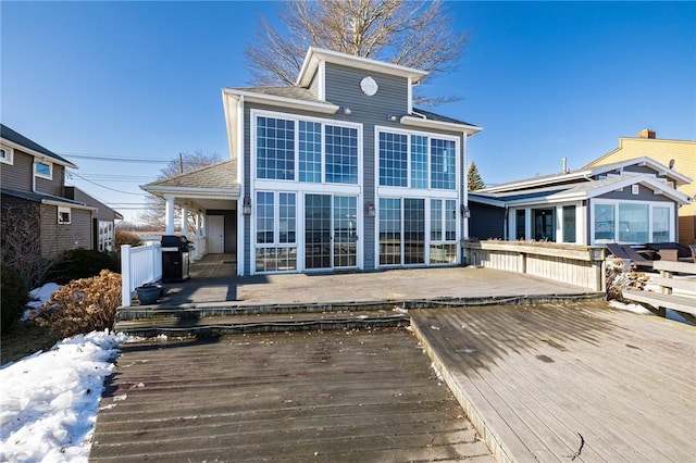 back of house featuring a deck