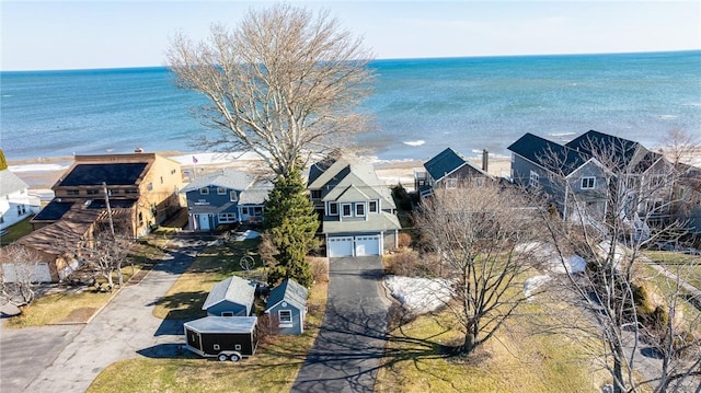 birds eye view of property featuring a residential view and a water view