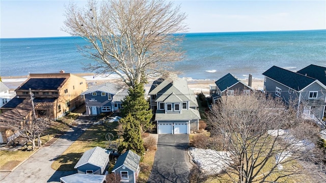 aerial view with a water view and a residential view