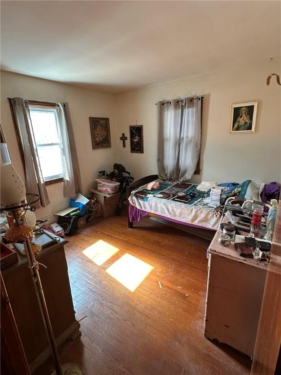 bedroom with wood finished floors