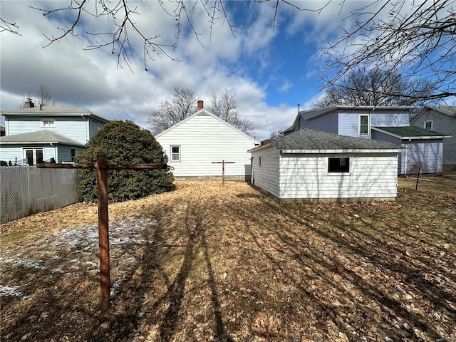 view of yard with an outbuilding and fence