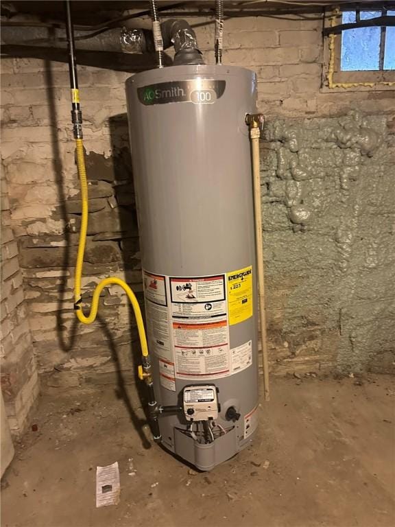 utility room with gas water heater