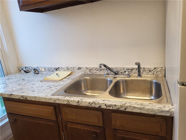 details featuring light countertops and a sink